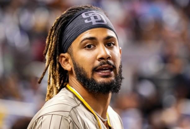 Fernando Tatis Jr. #23 of the San Diego Padres looks on while in the dugout during the game against the Miami Marlins at loanDepot park on July 23,...