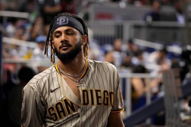Fernando Tatis Jr. #23 of the San Diego Padres looks on while in the dugout during the game against the Miami Marlins at loanDepot park on July 23,...