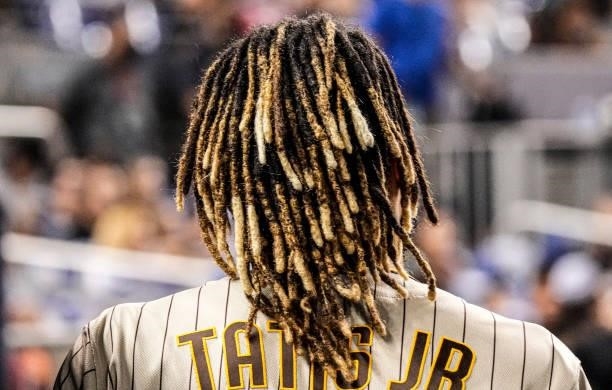 General view of the hair of Fernando Tatis Jr. #23 of the San Diego Padres while in the dugout during the game against the Miami Marlins at loanDepot...