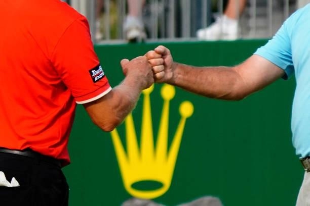Jerry Kelly of United States bumps fists with Bernhard Langer of Germany during the third round of the Senior Open presented by Rolex at Sunningdale...