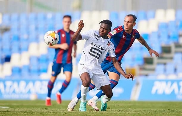 Son Hidalgo of Levante UD competes for the ball with Lesley Uhochucku of Stade Rennais during a Pre-Season friendly match between Levante UD and...