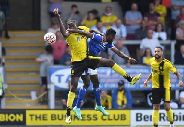 Lucas Akins of Burton Albion is challenged by Wilfred Ndidi of Leicester City during the Pre-Season Friendly match between Burton Albion and...