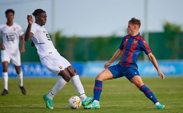 Dani Gomez of Levante UD competes for the ball with Lesley Uhochucku of Stade Rennais during a Pre-Season friendly match between Levante UD and Stade...