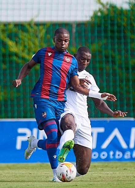 Mickael Malsa of Levante UD competes for the ball with Serhou Guirassy of Stade Rennais during a Pre-Season friendly match between Levante UD and...