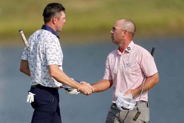Bo Hoag and Ryan Armour shake hands after their round during the Third Round of the 3M Open at TPC Twin Cities on July 24, 2021 in Blaine, Minnesota.