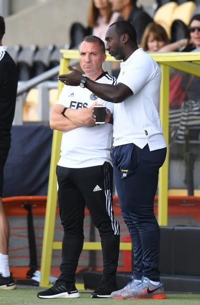 Leicester City Manager Brendan Rodgers talks to Burton Albion Manager Jimmy Floyd Hasselbaink before the Pre-Season Friendly match between Burton...