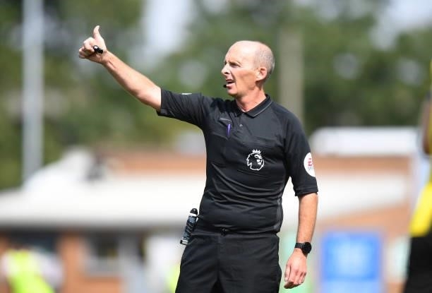 Referee Mike Dean during the Pre-Season Friendly match between Burton Albion and Leicester City at Pirelli Stadium on July 24, 2021 in...