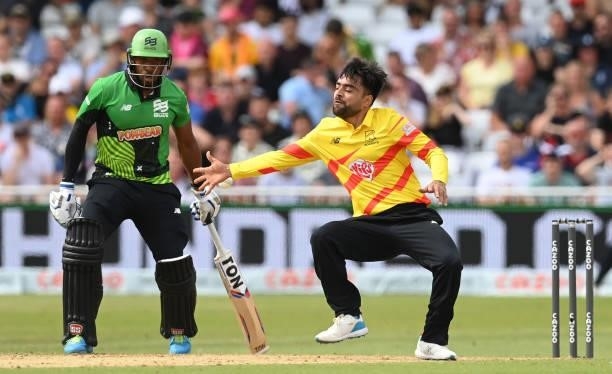 Rashid Khan of Trent Rockets fails to stop the ball as Chris Jordan of Southern Brave watches during the Hundred Match between Trent Rockets and...