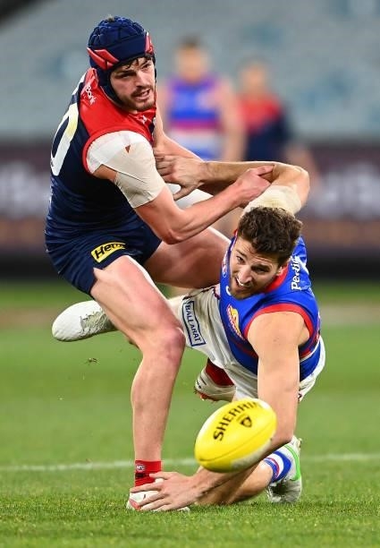 Angus Brayshaw of the Demons and Marcus Bontempelli of the Bulldogs compete for the ball during the round 20 AFL match between Melbourne Demons and...