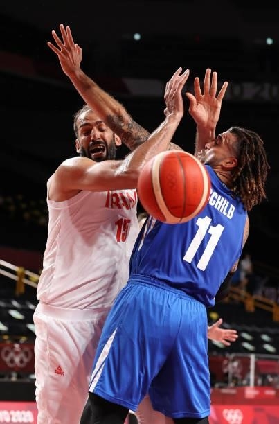 Hamed Haddadi of Team Iran is pressured by Blake Schilb of Team Czech Republic during the first half on day two of the Tokyo 2020 Olympic Games at...