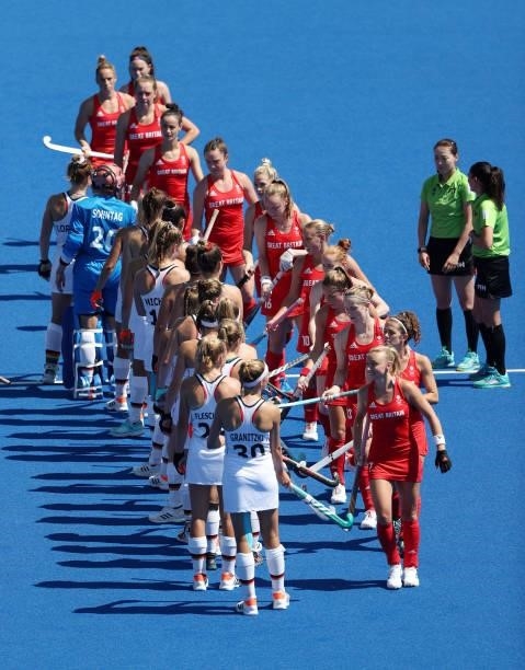 Team Great Britain and Team Germany greet each other prior to the Women's Pool A match on day two of the Tokyo 2020 Olympic Games at Oi Hockey...