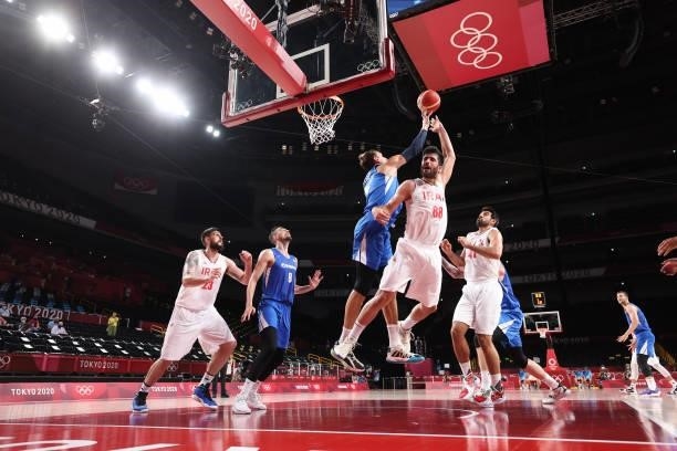 Jan Vesely of Team Czech Republic blocks a shot by Behnam Yakhchalidehkordi of Team Iran during the first half on day two of the Tokyo 2020 Olympic...