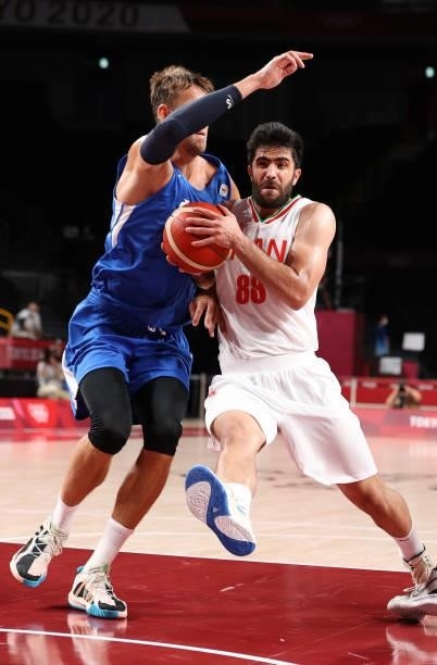 Behnam Yakhchalidehkordi of Team Iran drives to the basket against Jan Vesely of Team Czech Republic during the first half on day two of the Tokyo...