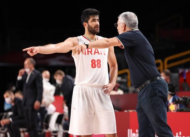 Head coach Mehran Shahintab of Team Iran talks with Behnam Yakhchalidehkordi during the second half on day two of the Tokyo 2020 Olympic Games...