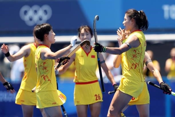 Xiaoxue Zhang, Bingfeng Gu, Meiyu Liang and Yang Chen of Team China celebrate their first goal during the Women's Pool B Match against Team Japan on...