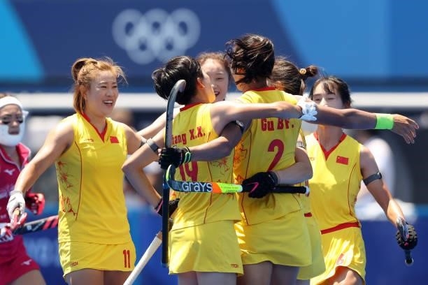 Xiaoxue Zhang, Bingfeng Gu, Meiyu Liang and Yang Chen of Team China celebrate their first goal during the Women's Pool B Match against Team Japan on...