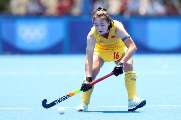 Zixia Ou of Team China controls the ball during the Women's Pool B Match against Team Japan on day two of the Tokyo 2020 Olympic Games at Oi Hockey...