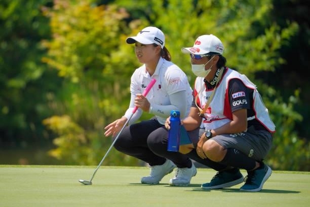 Mao Saigo of Japan lines up a putt on the 9th green during the final round of Daito Kentaku eHeyanet Ladies at Takino Country Club on July 25, 2021...
