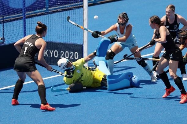 Kelsey Smith of Team New Zealand scores a goal on Maria Belen Succi of Team Argentina during the Women's Pool B match on day two of the Tokyo 2020...