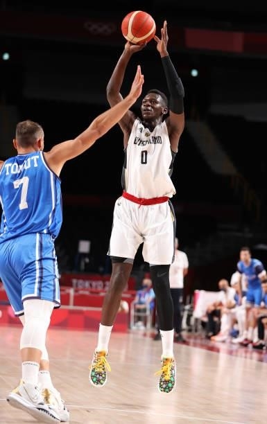 Isaac Bonga of Team Germany shoots against Stefano Tonut of Team Italy during the first half on day two of the Tokyo 2020 Olympic Games at Saitama...