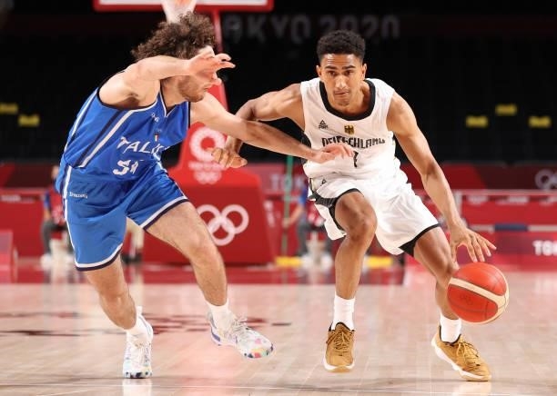 Maodo Lo of Team Germany drives to the basket against Alessandro Pajola of Team Italy during the first half on day two of the Tokyo 2020 Olympic...