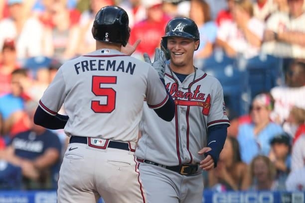 Freddie Freeman of the Atlanta Braves is congratulated by Joc Pederson after he hit a two-run home run during the first inning against the...