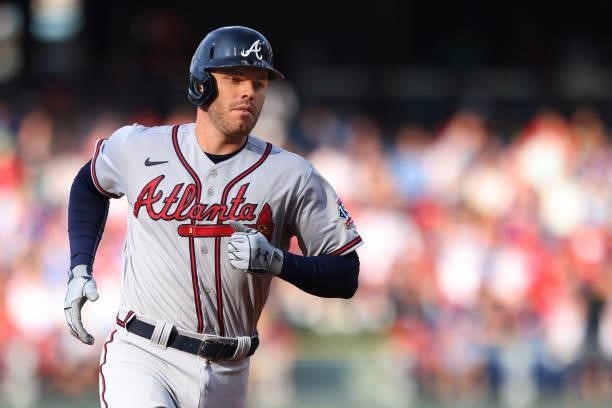 Freddie Freeman of the Atlanta Braves circles the bases after he hit a two-run home run during the first inning against the Philadelphia Phillies in...
