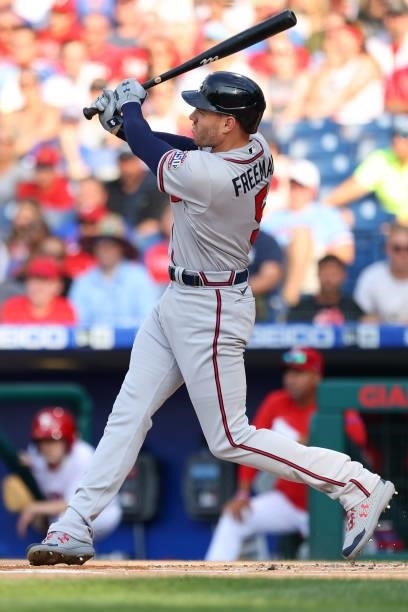 Freddie Freeman of the Atlanta Braves hits a two-run home run during the first inning against the Philadelphia Phillies in the first inning of a game...