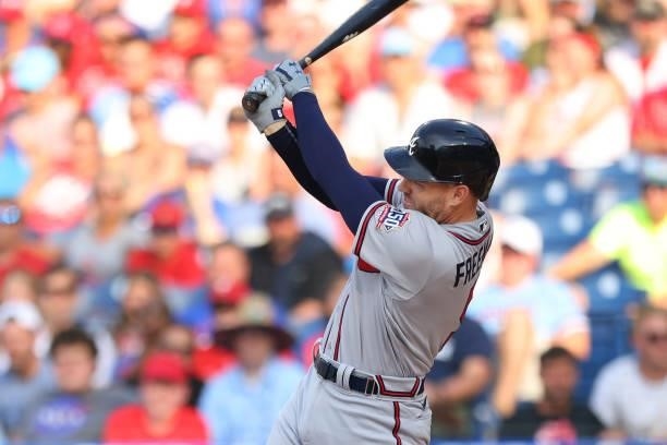 Freddie Freeman of the Atlanta Braves hits a two-run home run during the first inning against the Philadelphia Phillies in the first inning of a game...