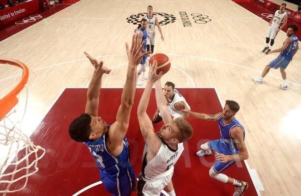 Niels Giffey of Team Germany goes up for a shot against Simone Fontecchio of Team Italy during the first half on day two of the Tokyo 2020 Olympic...