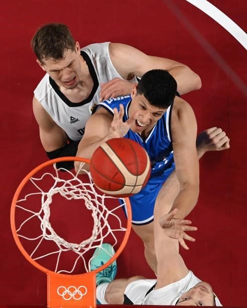Simone Fontecchio of Team Italy goes up for a shot against Moritz Wagner of Team Germany during the first half on day two of the Tokyo 2020 Olympic...