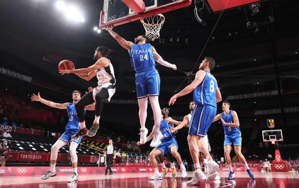 Joshiko Saibou of Team Germany passes under Riccardo Moraschini of Team Italy during the first half on day two of the Tokyo 2020 Olympic Games at...