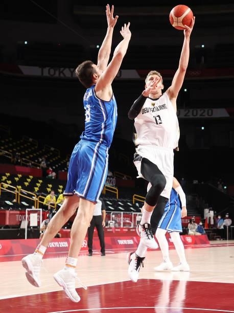 Moritz Wagner of Team Germany shoots against Nicolo Melli of Team Italy during the first half on day two of the Tokyo 2020 Olympic Games at Saitama...