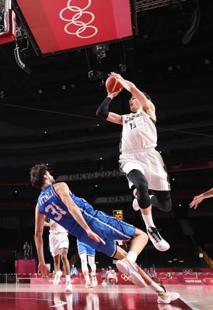 Moritz Wagner of Team Germany shoots against Michele Vitali of Team Italy during the first half on day two of the Tokyo 2020 Olympic Games at Saitama...