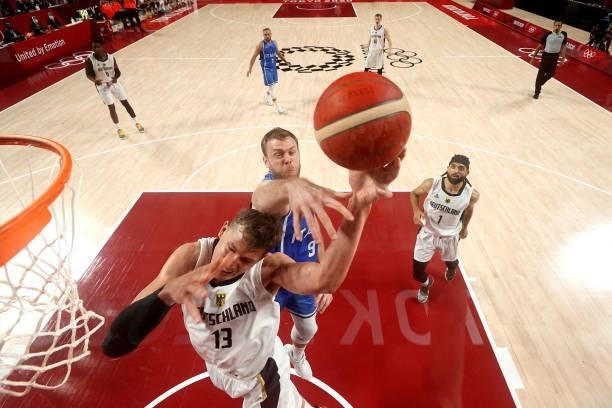Moritz Wagner of Team Germany goes up for a shot against Nicolo Melli of Team Italy during the second half on day two of the Tokyo 2020 Olympic Games...