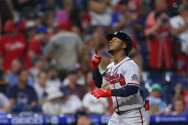 Ozzie Albies of the Atlanta Braves gestures after he hit a three-run home run during the eighth inning against the Philadelphia Phillies in a game at...