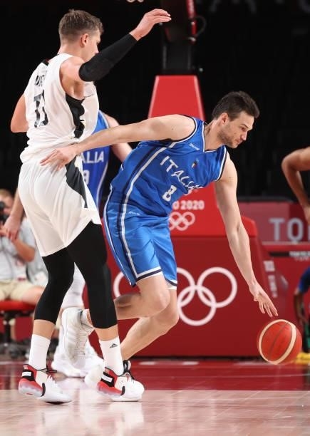 Danilo Gallinari of Team Italy is pressured by Moritz Wagner of Team Germany during the second half on day two of the Tokyo 2020 Olympic Games at...