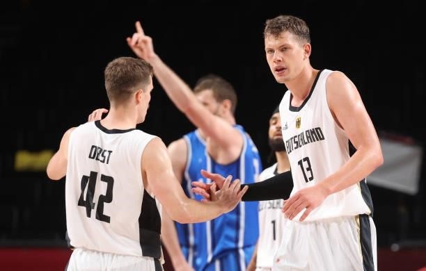 Moritz Wagner and Andreas Obst of Team Germany celebrate against Italy during the second half on day two of the Tokyo 2020 Olympic Games at Saitama...