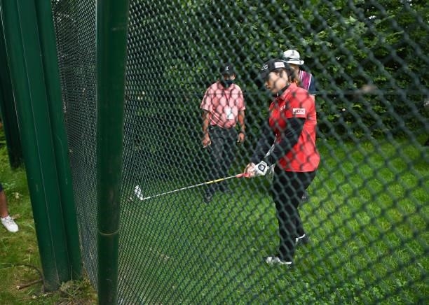 Ariya Jutanugarn of Thailand looks to play after her tee shot hit a fence on the ninth hole during day three of the The Amundi Evian Championship at...