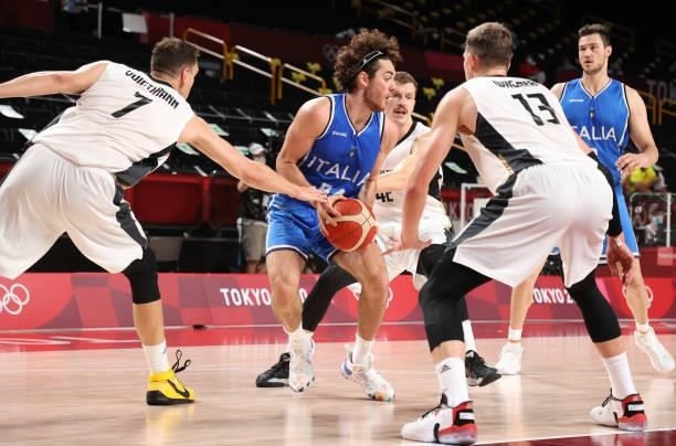 Alessandro Pajola of Team Italy is pressured by Johannes Voigtmann, Andreas Obst and Moritz Wagner of Team Germany during the second half on day two...