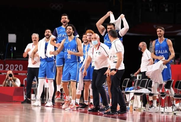 Members of team Italy celebrate against Germany during the second half on day two of the Tokyo 2020 Olympic Games at Saitama Super Arena on July 25,...