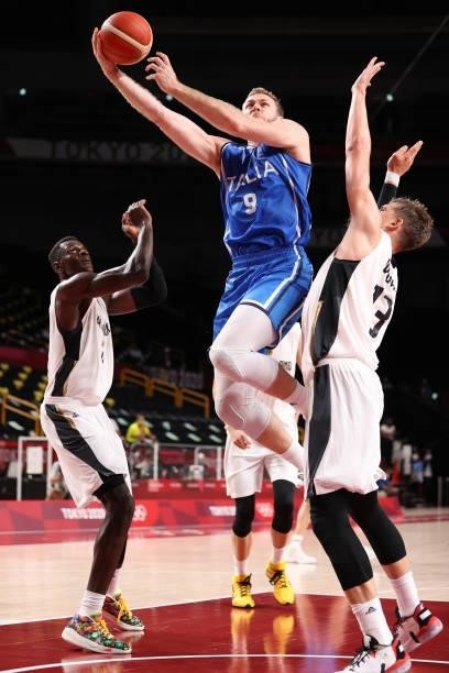 Nicolo Melli of Team Italy goes up for a shot against Moritz Wagner of Team Germany during the second half on day two of the Tokyo 2020 Olympic Games...