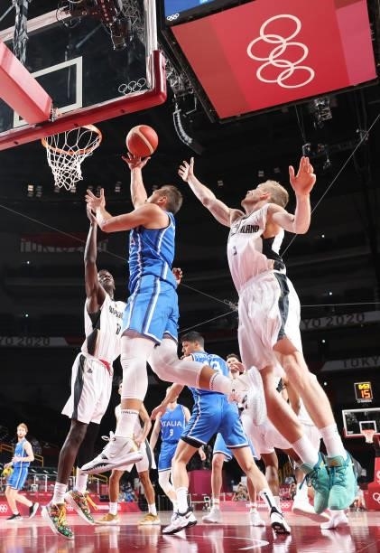 Stefano Tonut of Team Italy drives to the basket against Niels Giffey of Team Germany during the second half on day two of the Tokyo 2020 Olympic...