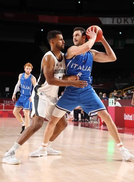 Danilo Gallinari of Team Italy is defended by Johannes Thiemann of Team Germany during the second half on day two of the Tokyo 2020 Olympic Games at...