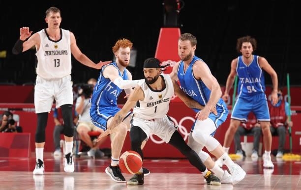 Joshiko Saibou of Team Germany is pressured by Niccolo Mannion and Stefano Tonut of Team Italy during the second half on day two of the Tokyo 2020...