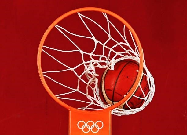 Basketball goes through the net during the second half on day two between Italy and Germany of the Tokyo 2020 Olympic Games at Saitama Super Arena on...