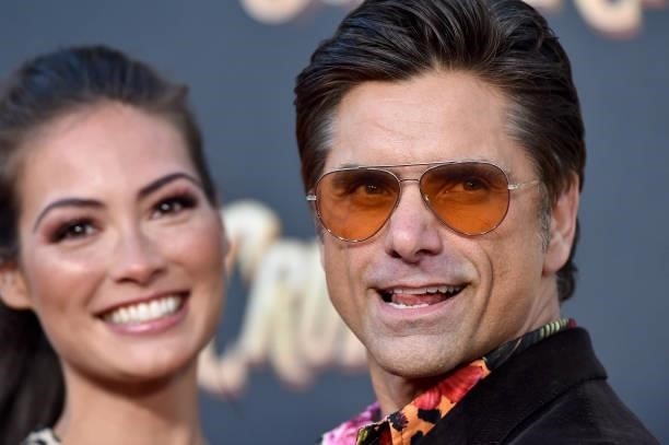 Caitlin McHugh and John Stamos attend the World Premiere of Disney's "Jungle Cruise
