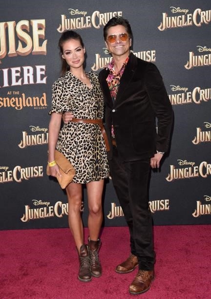 Caitlin McHugh and John Stamos attend the World Premiere of Disney's "Jungle Cruise