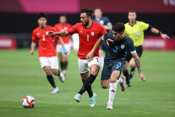 Salah Mohsen of Team Egypt battles for possession with Claudio Bravo of Team Argentina during the Men's First Round Group C match between Egypt and...