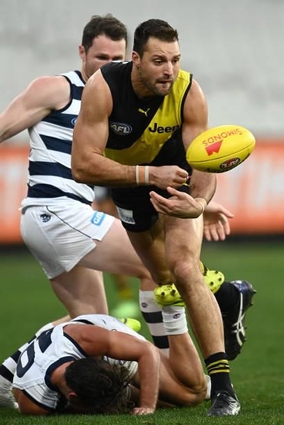Toby Nankervis of the Tigers handballs during the round 19 AFL match between Geelong Cats and Richmond Tigers at Melbourne Cricket Ground on July 25,...